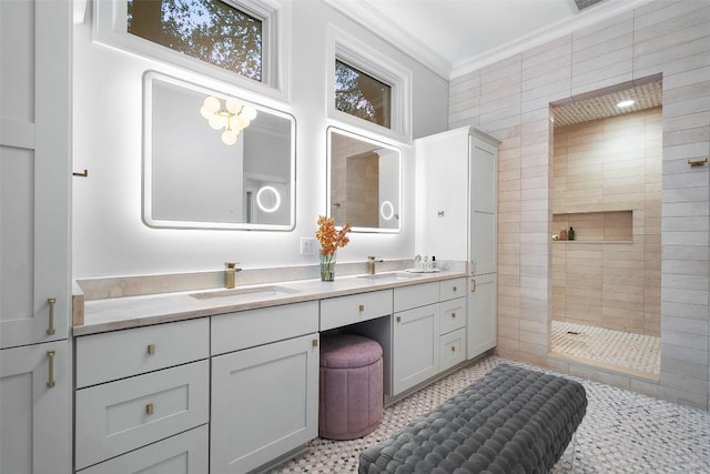 full bath with vanity, ornamental molding, and walk in shower