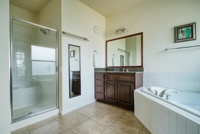 112 Bearing Cv, Austin, TX 78717 - bathroom with vanity, tile patterned flooring, a stall shower, and a bath