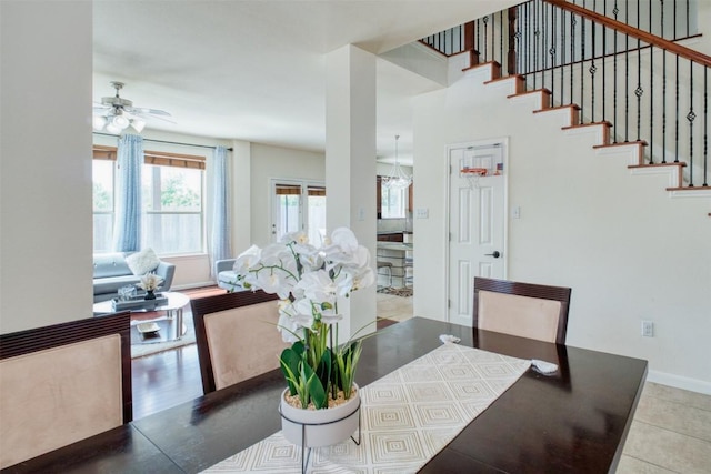 112 Bearing Cv, Austin, TX 78717 - tiled dining room featuring baseboards, stairs, and ceiling fan