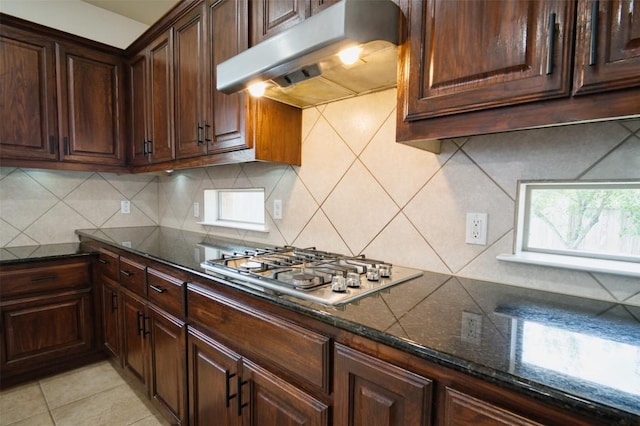 112 Bearing Cv, Austin, TX 78717 - kitchen featuring tasteful backsplash, stainless steel gas cooktop, under cabinet range hood, and dark stone countertops