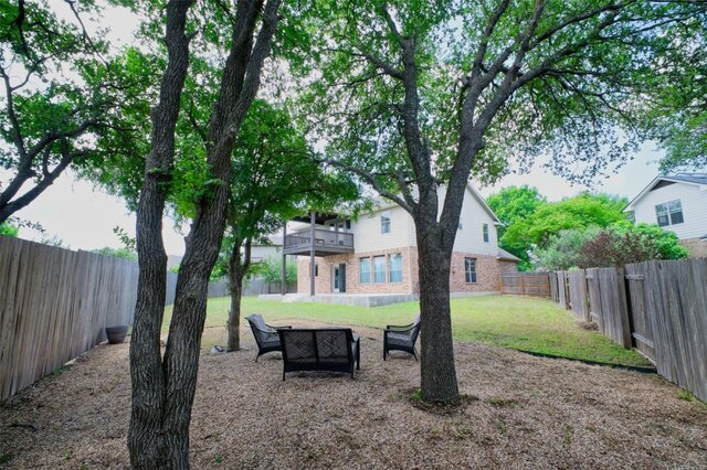 112 Bearing Cv, Austin, TX 78717 - view of yard featuring a fenced backyard and a balcony