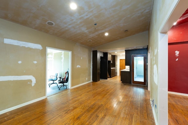 unfurnished room with recessed lighting, baseboards, and light wood-style floors