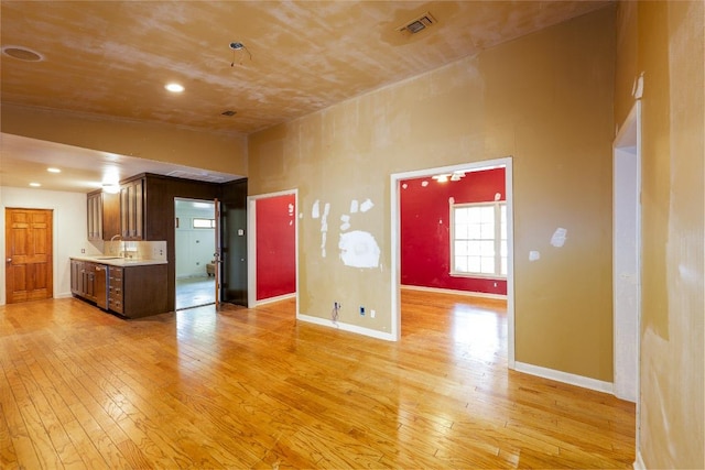 2907 Pinecrest Dr, Austin, TX 78757 - unfurnished living room featuring light wood finished floors and baseboards