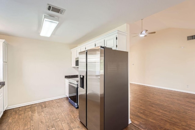 kitchen with appliances with stainless steel finishes, light wood-style floors, a ceiling fan, white cabinetry, and visible vents