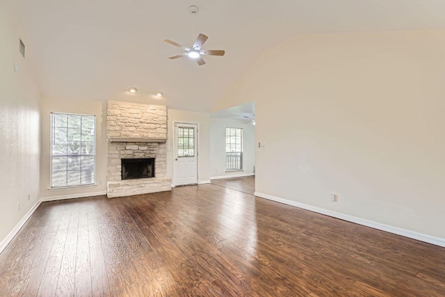 unfurnished living room with baseboards, a fireplace, a ceiling fan, and dark wood-style flooring