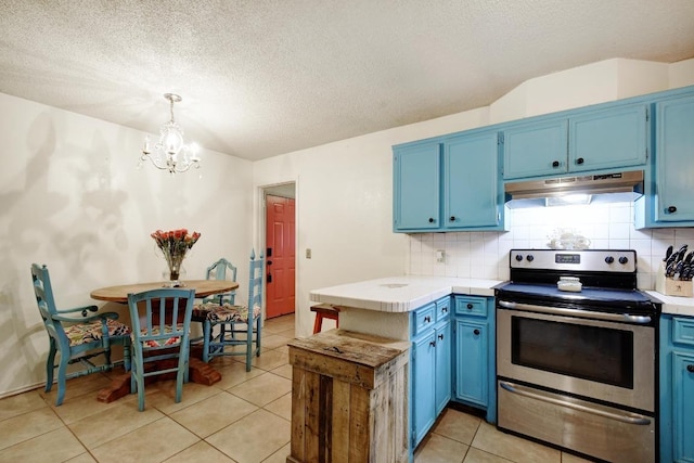 kitchen with tile countertops, blue cabinetry, under cabinet range hood, and stainless steel electric range oven