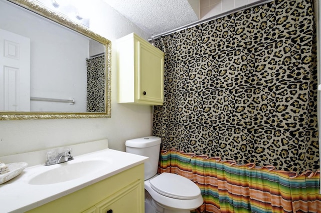 bathroom featuring toilet, a shower with curtain, and vanity