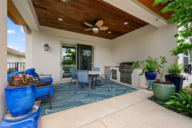 228 Cimarron Hills Trl E, Georgetown, TX 78628 - view of patio featuring exterior kitchen, outdoor dining area, and ceiling fan