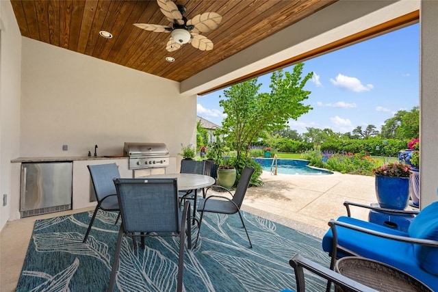 228 Cimarron Hills Trl E, Georgetown, TX 78628 - view of patio / terrace with an outdoor kitchen, ceiling fan, an outdoor pool, and outdoor dining area