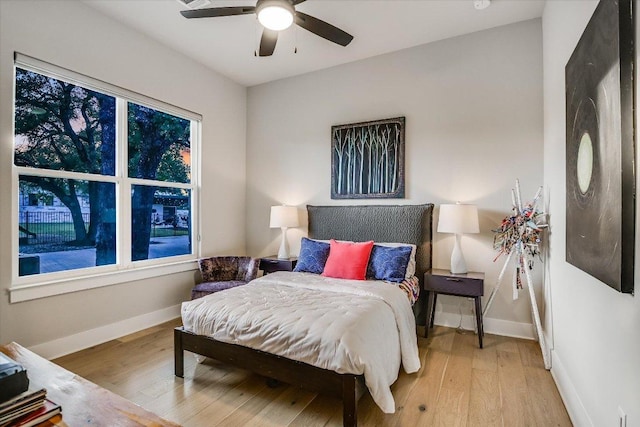1117 Eagle Point Dr, Georgetown, TX 78628 - bedroom featuring light wood finished floors, baseboards, and ceiling fan