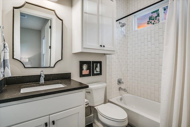 full bath with vanity, toilet, and shower / tub combo