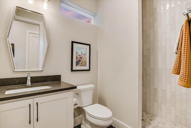 1117 Eagle Point Dr, Georgetown, TX 78628 - full bathroom with a tile shower, vanity, and toilet