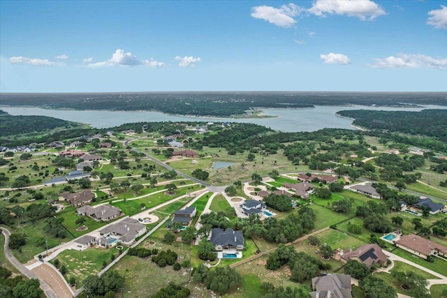 drone / aerial view with a water view and a residential view