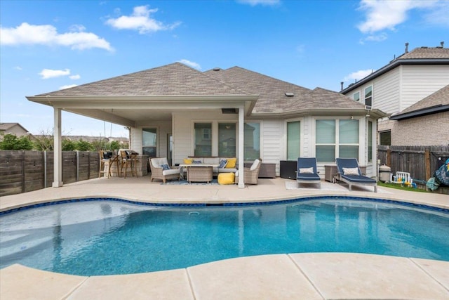 view of pool featuring an outdoor living space, a fenced backyard, a fenced in pool, and a patio