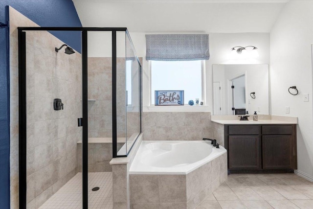 6401 Golden Bough Ln, Pflugerville, TX 78660 - full bathroom featuring a bath, vanity, a stall shower, and tile patterned flooring