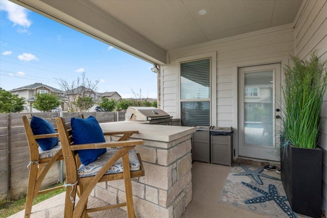 view of patio with a grill and an outdoor kitchen
