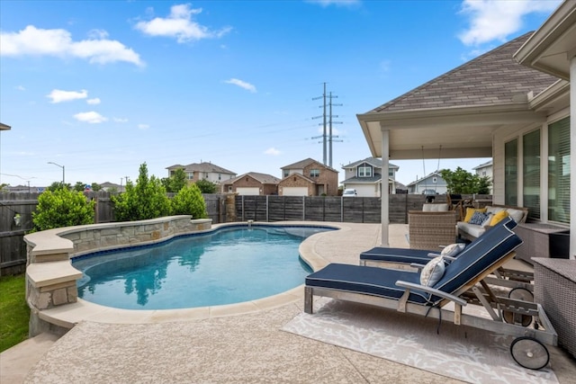view of pool featuring a fenced in pool, a fenced backyard, a patio area, and a residential view