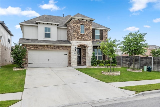 view of front of house featuring an attached garage, fence, driveway, and a front yard