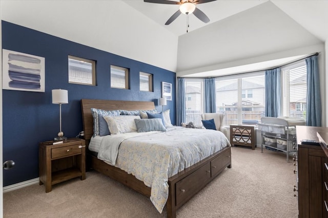 bedroom with baseboards, a ceiling fan, high vaulted ceiling, and light colored carpet