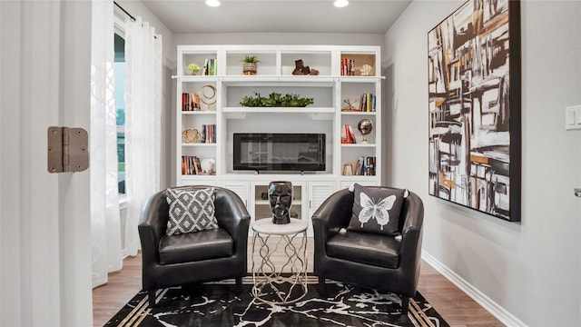 1621 Winding Stream Trl, Leander, TX 78641 - living area with wood finished floors, baseboards, and recessed lighting