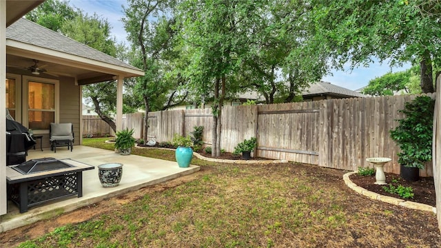 1621 Winding Stream Trl, Leander, TX 78641 - fenced backyard featuring a patio area, ceiling fan, and an outdoor fire pit