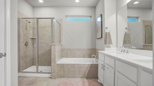 bathroom featuring a sink, tile patterned flooring, a stall shower, and a bath
