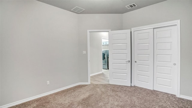 1621 Winding Stream Trl, Leander, TX 78641 - unfurnished bedroom featuring light colored carpet, washer / dryer, a closet, and baseboards
