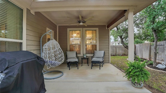 view of patio with ceiling fan, a fenced backyard, and a grill