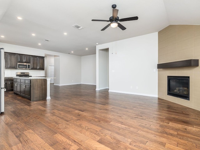 unfurnished living room with recessed lighting, ceiling fan, visible vents, and dark wood-style floors