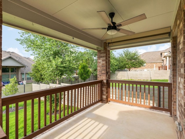deck with a yard, ceiling fan, and fence