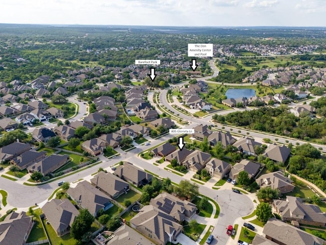 bird's eye view with a water view and a residential view