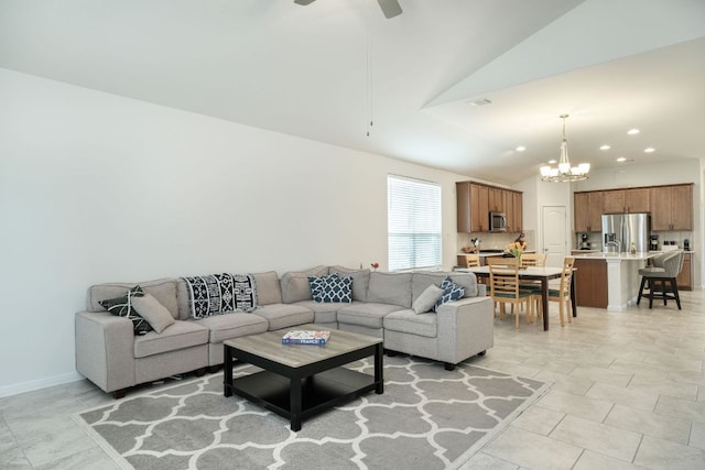 living room featuring recessed lighting, ceiling fan with notable chandelier, light tile patterned flooring, and vaulted ceiling
