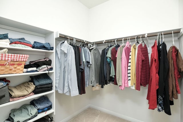 walk in closet featuring carpet