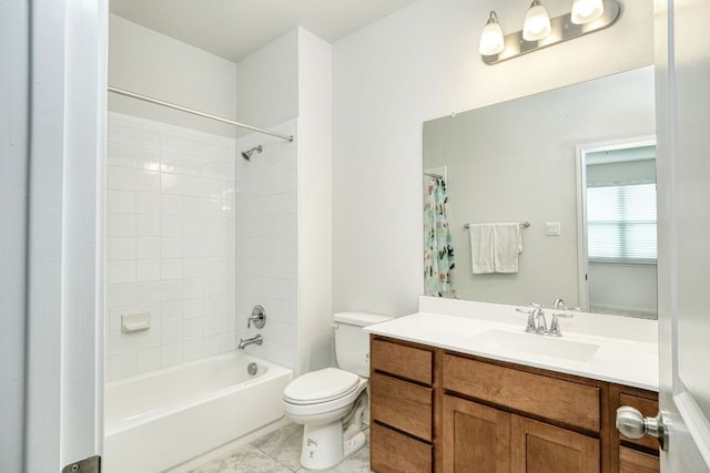 bathroom featuring vanity, tile patterned flooring, shower / bath combo, and toilet