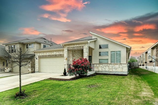 532 Tanda Ln, Hutto, TX 78634 - view of front of house with stone siding, a garage, concrete driveway, and a shingled roof