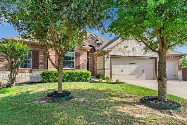 view of front of home with a front lawn, brick siding, a garage, stone siding, and driveway