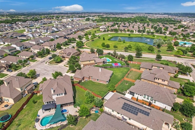 birds eye view of property featuring a water view and a residential view