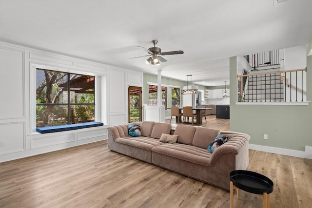9800 Knotty Pine Cv, Austin, TX 78750 - living area with ceiling fan, light wood-style flooring, and a decorative wall