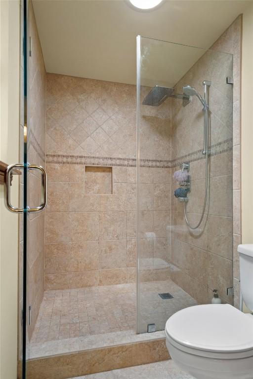 9800 Knotty Pine Cv, Austin, TX 78750 - bathroom with a stall shower and toilet