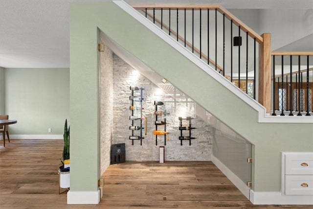 9800 Knotty Pine Cv, Austin, TX 78750 - wine area featuring baseboards and wood finished floors