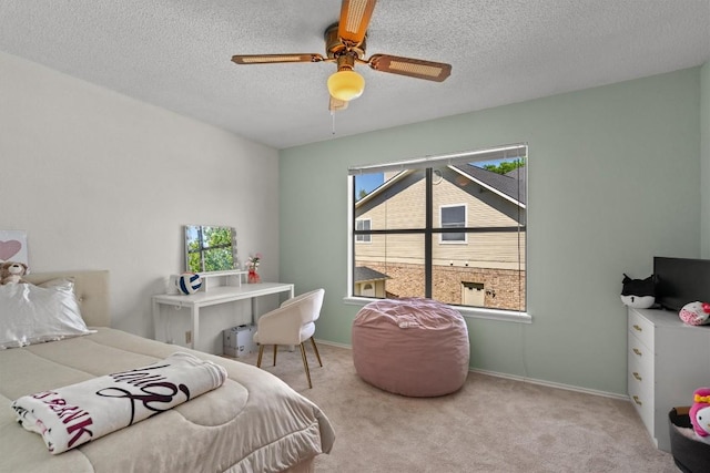 9800 Knotty Pine Cv, Austin, TX 78750 - bedroom featuring baseboards, carpet, a ceiling fan, and a textured ceiling
