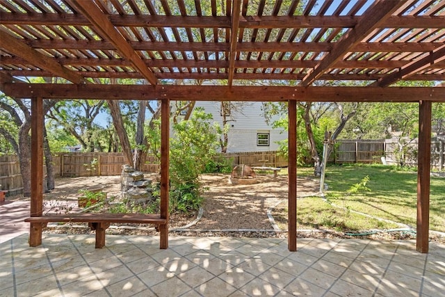 9800 Knotty Pine Cv, Austin, TX 78750 - view of patio featuring a fenced backyard and a fire pit