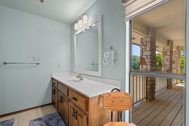 9800 Knotty Pine Cv, Austin, TX 78750 - bathroom featuring vanity and baseboards