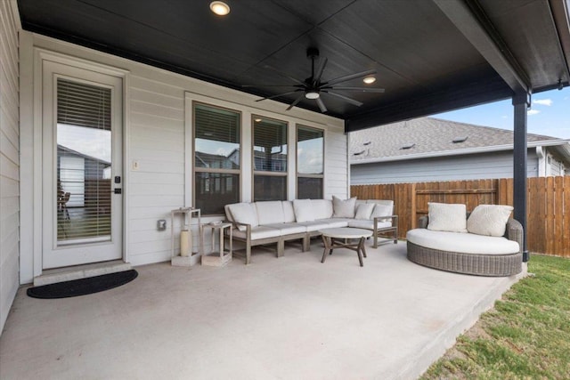 view of patio / terrace with fence, ceiling fan, and outdoor lounge area