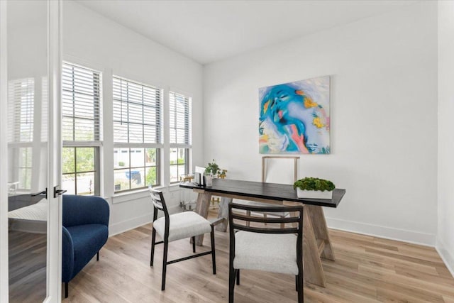 home office featuring baseboards and light wood-type flooring