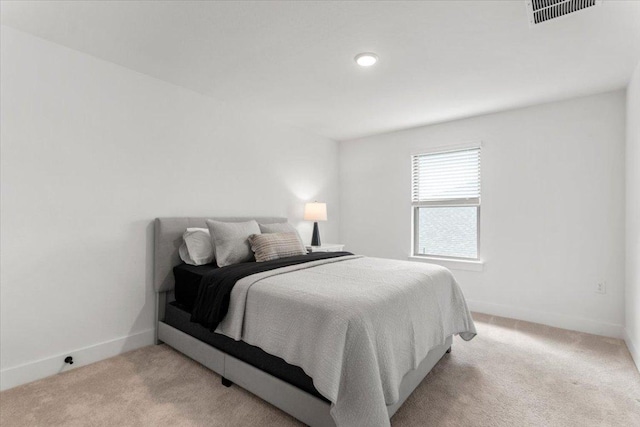 bedroom featuring baseboards, carpet, and visible vents