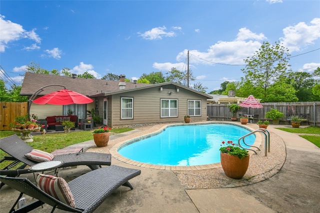 view of pool featuring a patio, a fenced backyard, an outdoor living space, and a fenced in pool