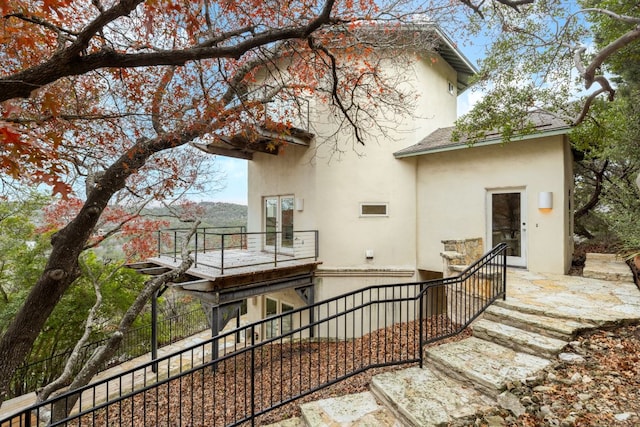 5310 Scenic View Dr, Austin, TX 78746 - rear view of property with stucco siding and a balcony