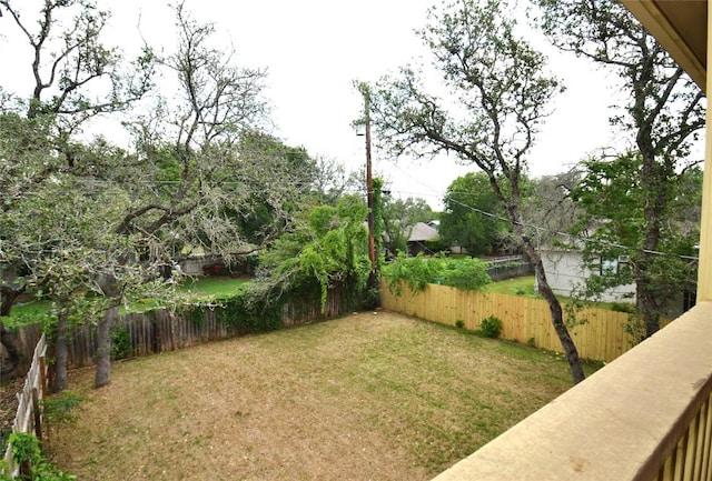 view of yard with a fenced backyard