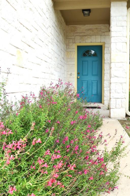 doorway to property featuring stone siding